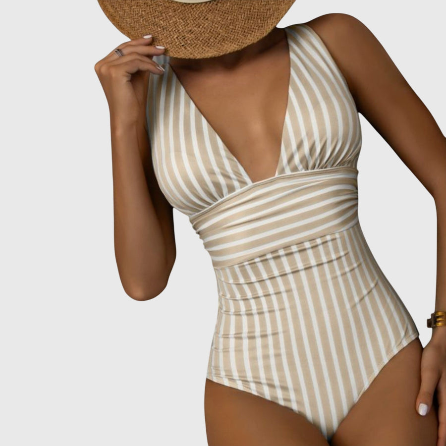 Women's one-piece swimsuit with a striped pattern, a halterneck design and a V-shaped neckline