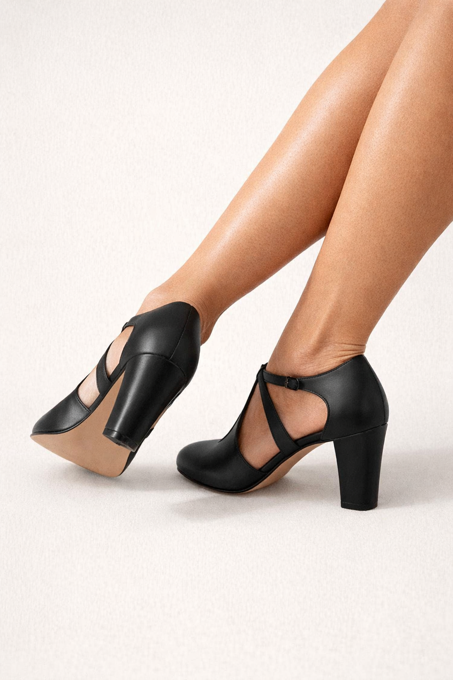 Women's heels with a T-shaped strap, cut-out detailing and a closed toe