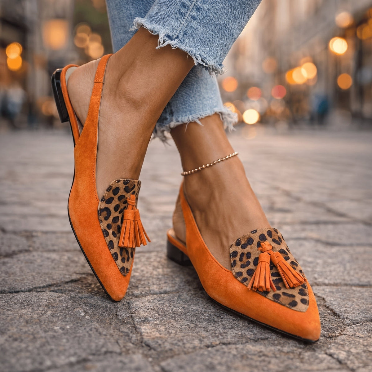 Women's flats with tassel detailing, a slingback strap and a pointed toe