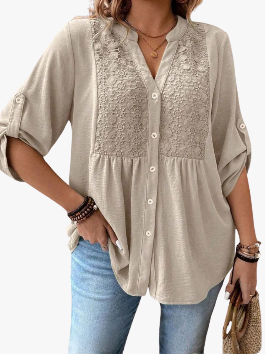 Women's blouse with a textured yoke, a button front and gathered detailing