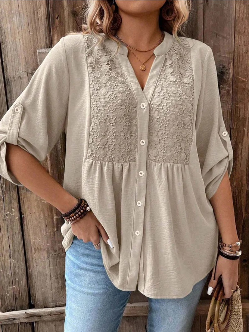 Women's blouse with a textured yoke, a button front and gathered detailing