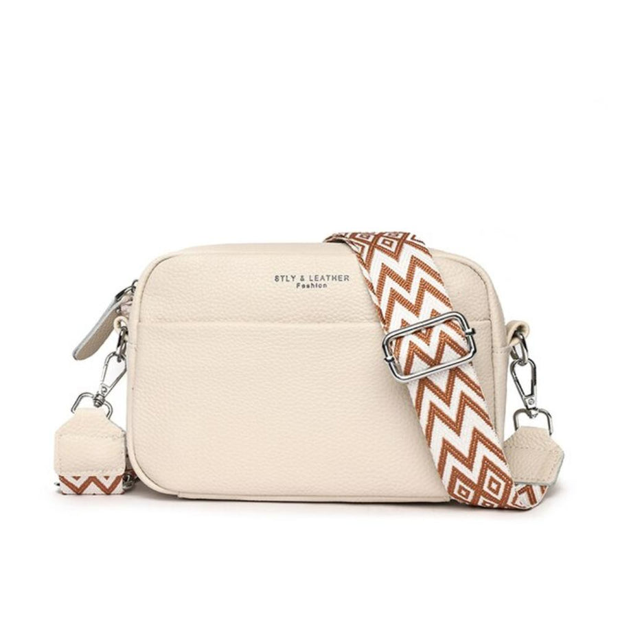 Women's handbag with a top zip, a front zip and a rectangular shape