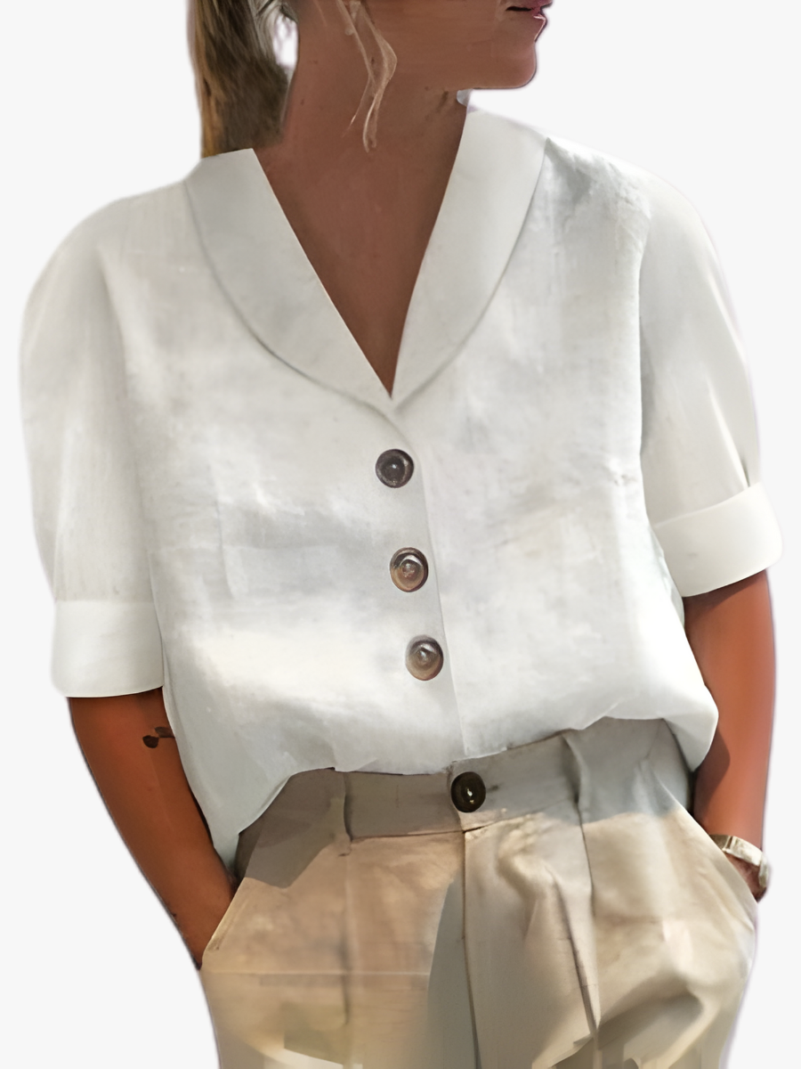 Women's shirt with a V-shaped neckline, large front buttons and turned-back sleeve cuffs