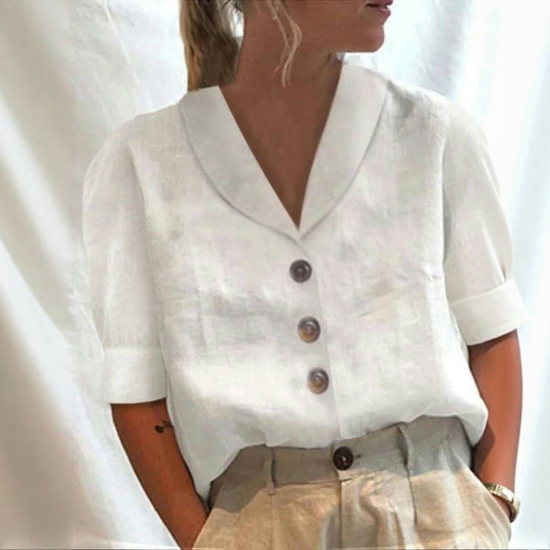 Women's shirt with a V-shaped neckline, large front buttons and turned-back sleeve cuffs