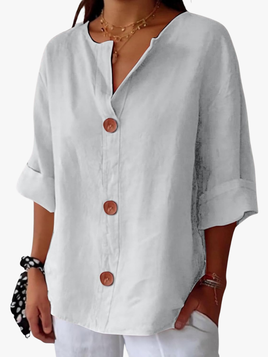 Women's shirt with a V-shaped neckline, large front buttons and elbow-length sleeves