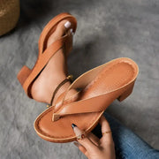 Women's heeled sandals with a toe-post design, a platform sole and an open toe