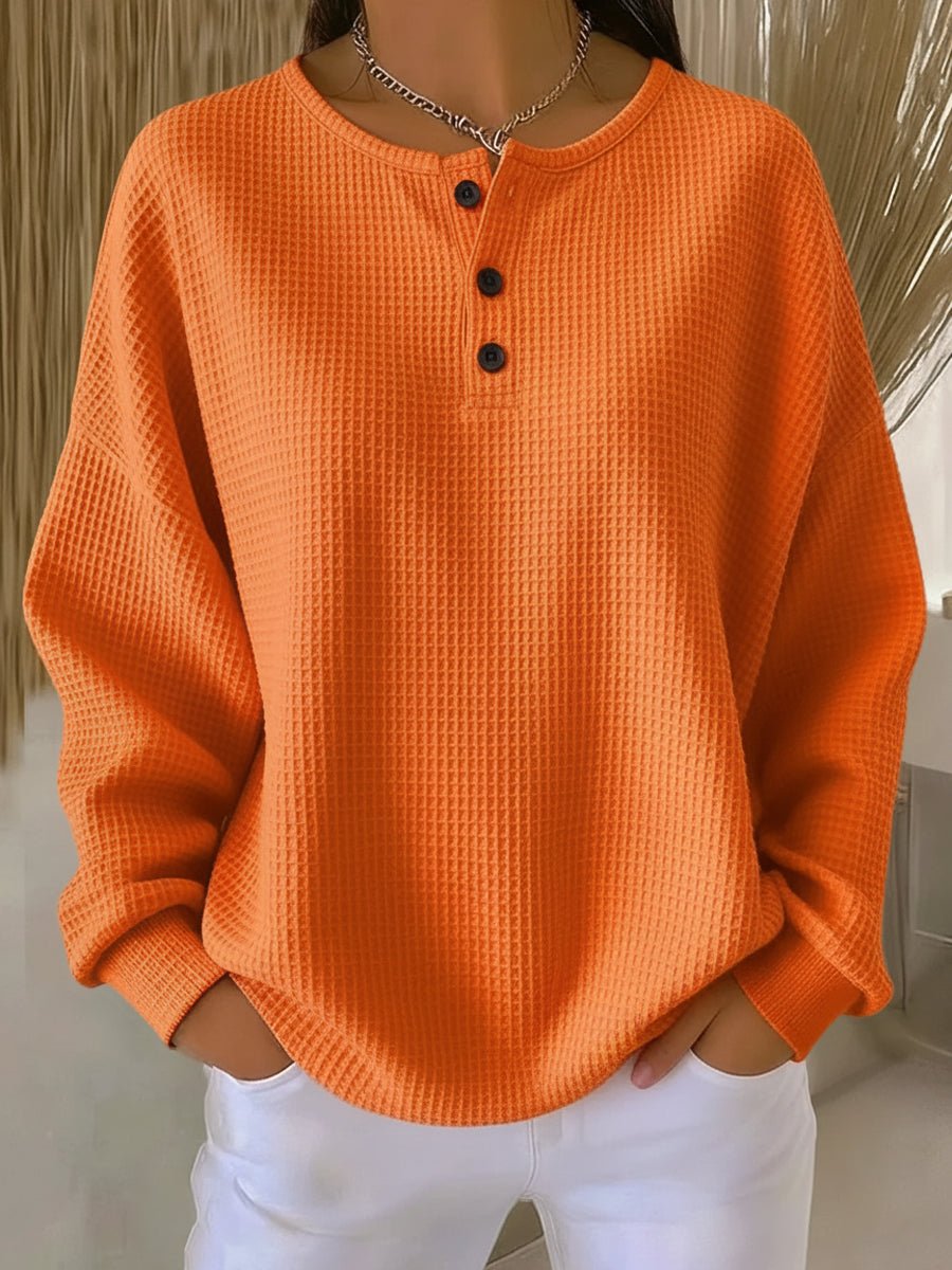 Women's sweatshirt with a waffle texture, a Henley-style button neckline and dropped shoulders