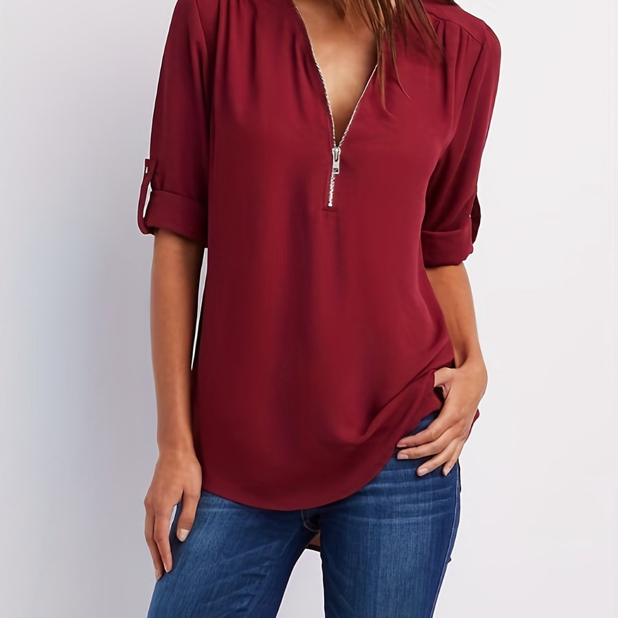 Women's blouse with a zipped neckline, a notched neckline and turned-up sleeves